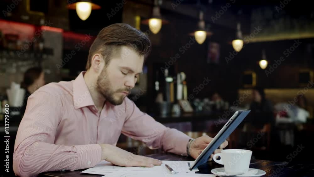 young business man is working in a bar young business man is working in a bar