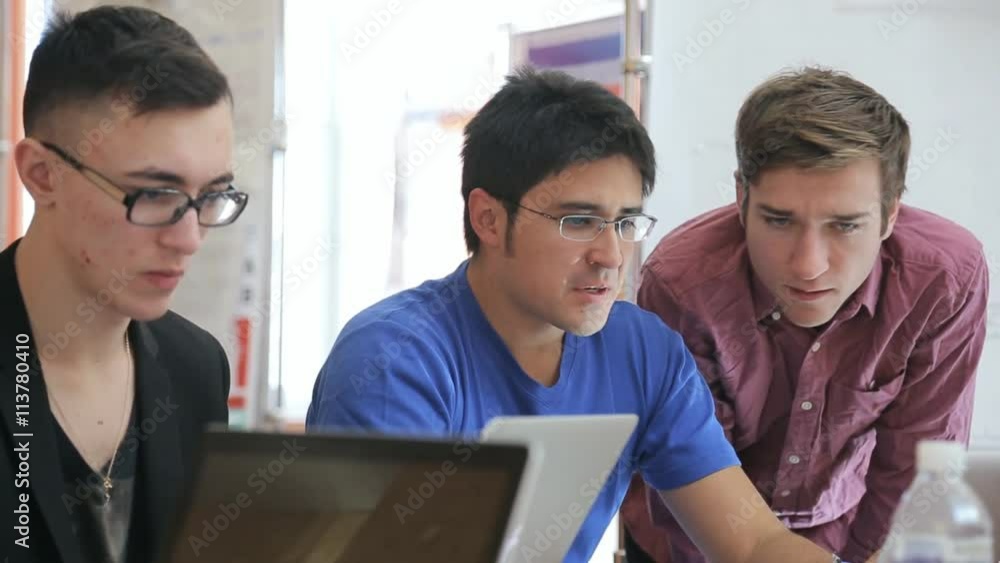 Designers and planners work on mockup of architectural constructions of city