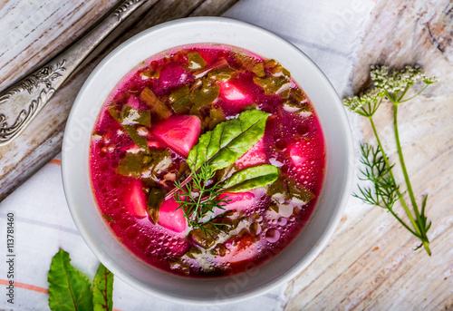 Soup with fresh young beet in bowl
