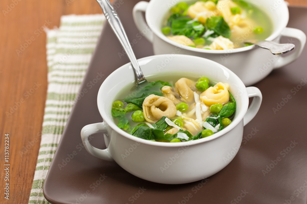 Tortellini Soup with Peas and Spinach. Selective focus. Tortellini Soup with Peas and Spinach. Selective focus.