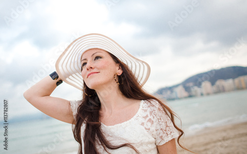 Pretty woman with white hat...