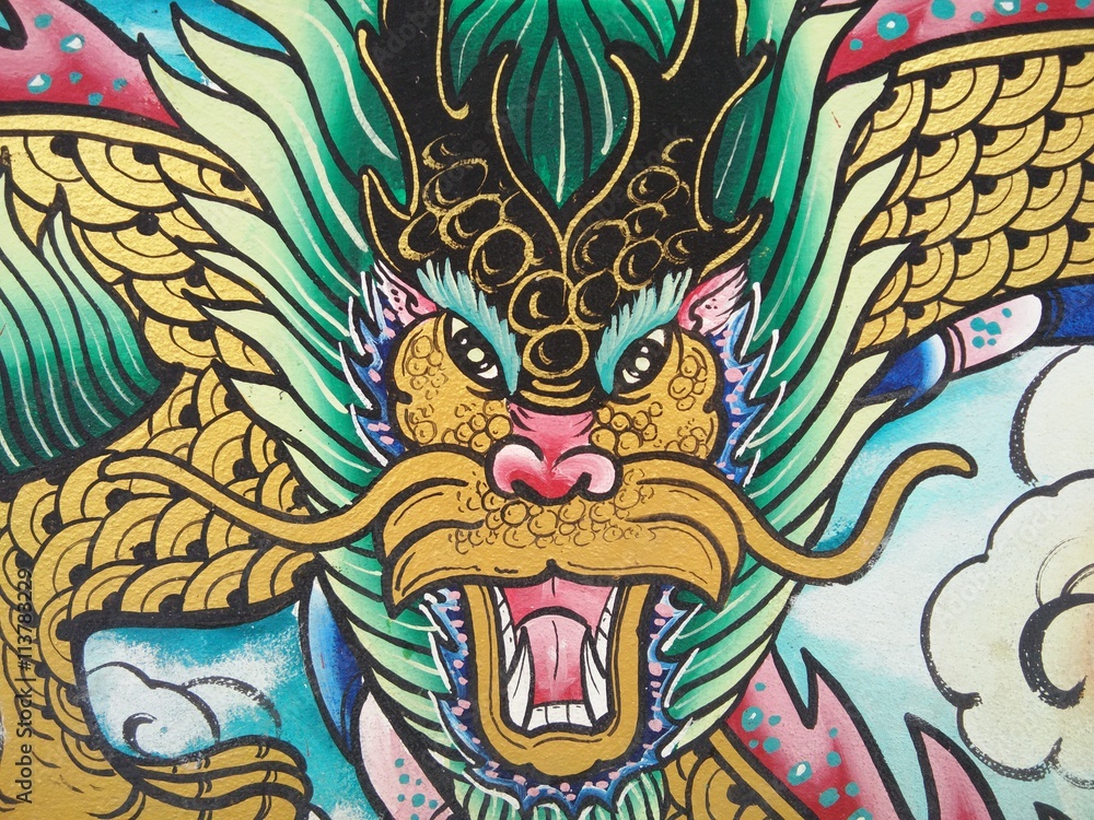 Painting dragon on the wall in temple of Thailand