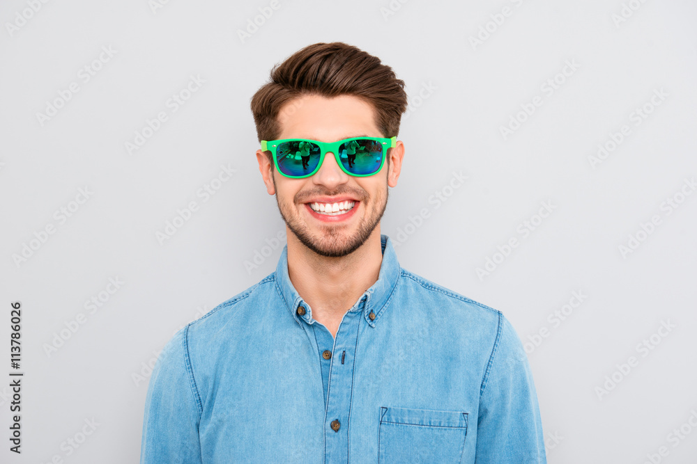 Portrait of handsome cheerful young smiling man in glasses Portrait of handsome cheerful young smiling man in glasses