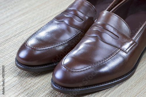 Pair of Stylish and Fashinable Brown Penny Loafer Shoes.