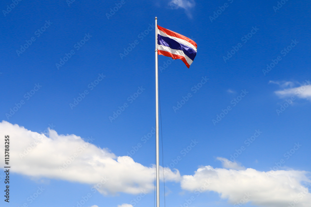 National flag of Thailand with blue sky background.