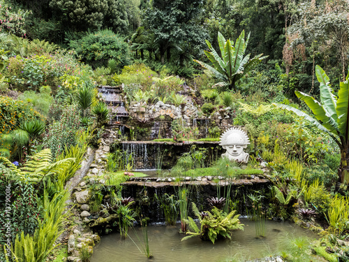 Waterfall with small statue photo