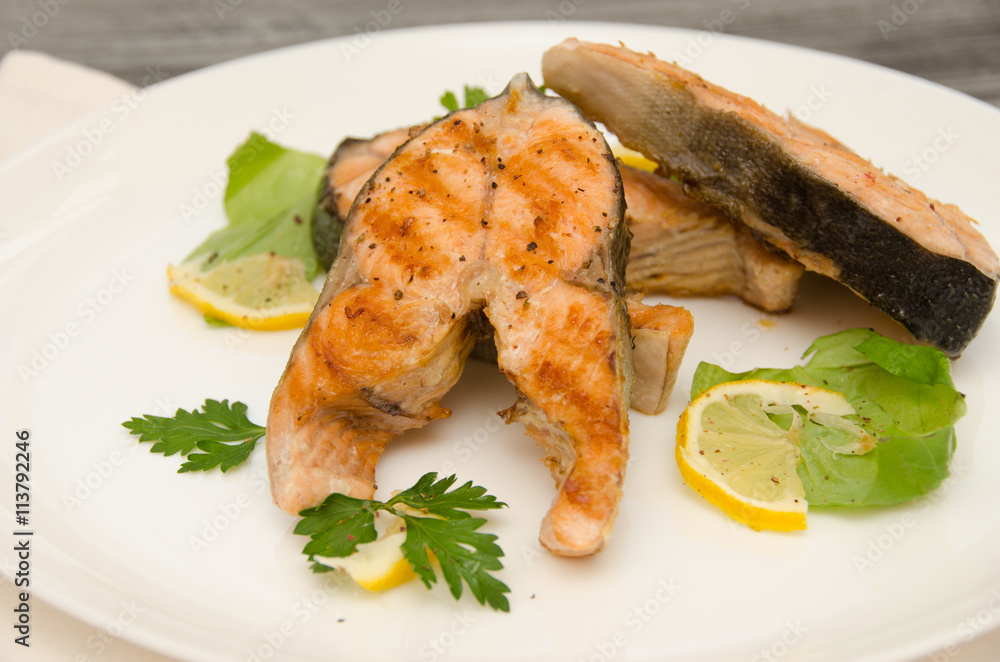 several salmon steaks white plate spices several salmon steaks white plate spices