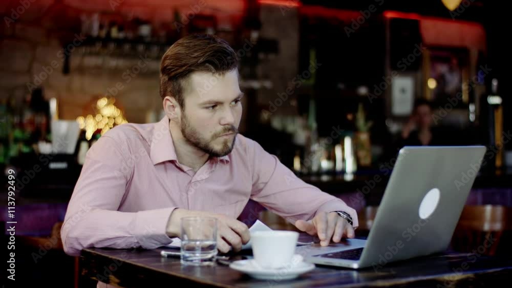 young business man has turned upset working in a bar young business man has turned upset working in a bar