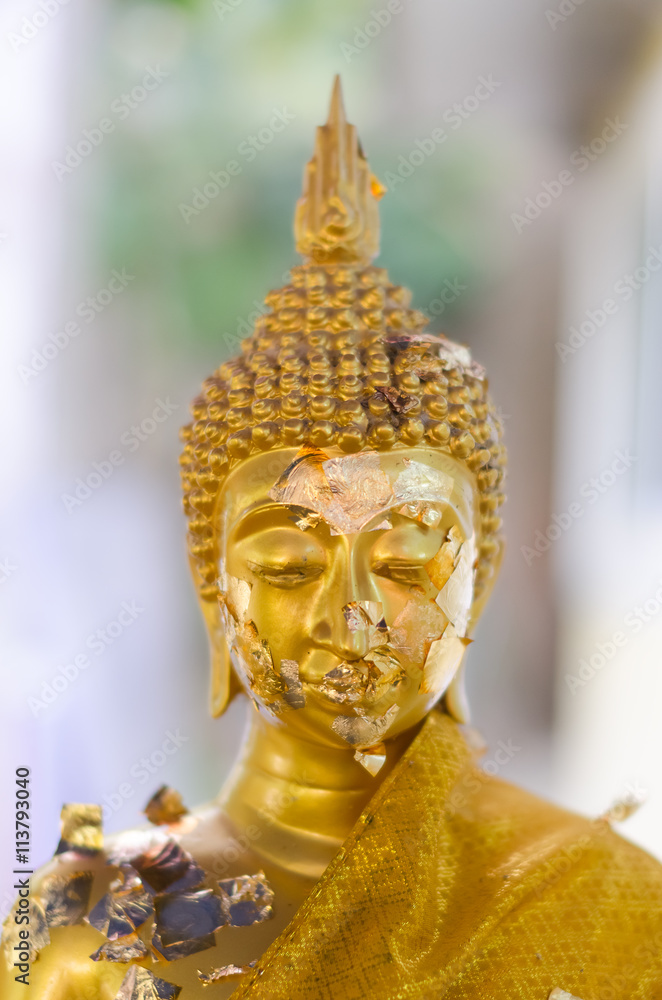Face of golden buddha sculpture, Thailand.