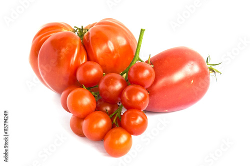 Various kinds of tomatoes isolated on white background photo