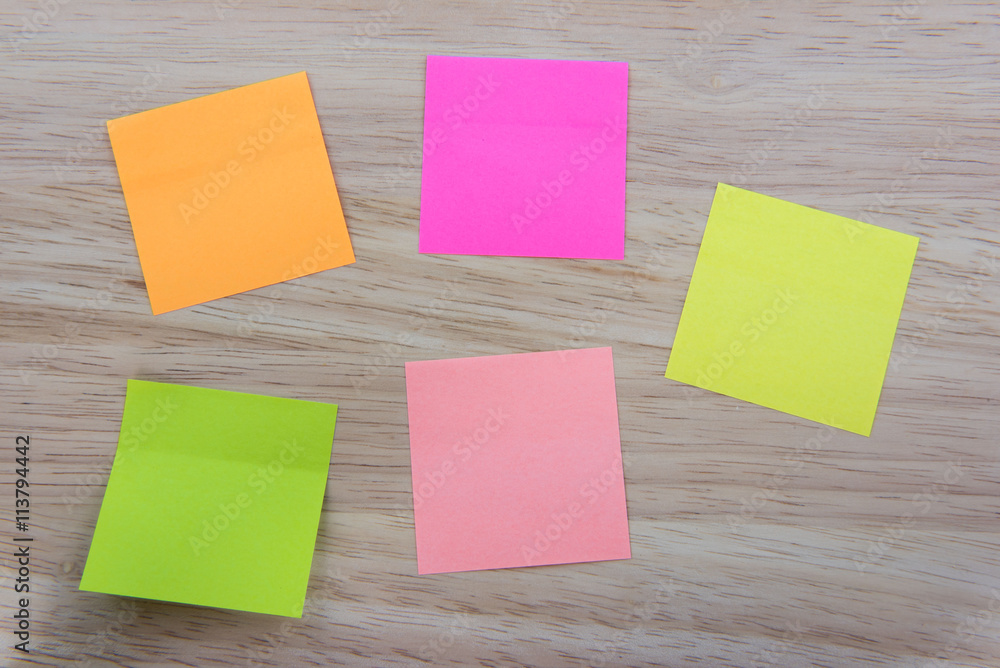 Color Paper notes with sticky note on Wood Background Color Paper notes with sticky note on Wood Background