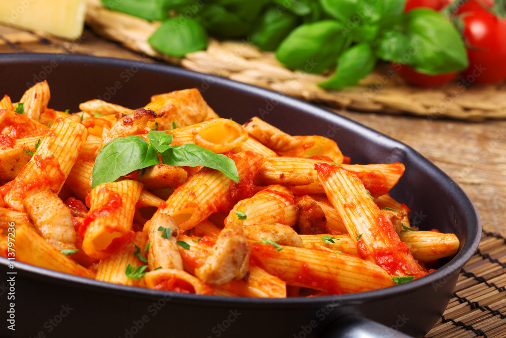 Penne with roasted chicken in tomato sauce Penne with roasted chicken in tomato sauce