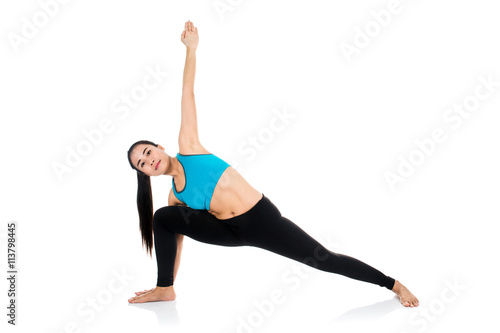 Yoga woman - pretty asian female in active wear doing yoga © sirikorn