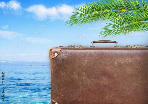 Concept of summer traveling with old suitcase © bennian_1