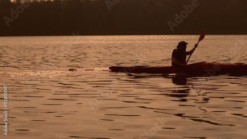 Wallpaper Mural Man paddles canoe in river at sunrise Torontodigital.ca