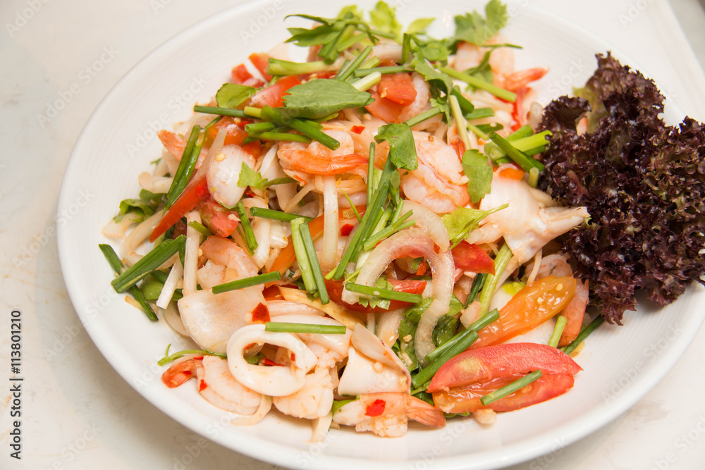 spicy salad with squid onion, green herbs and tomato spicy salad with squid onion, green herbs and tomato
