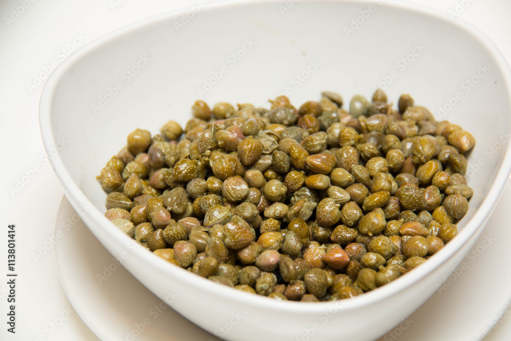 Pickled caper in Small white bowls Pickled caper in Small white bowls