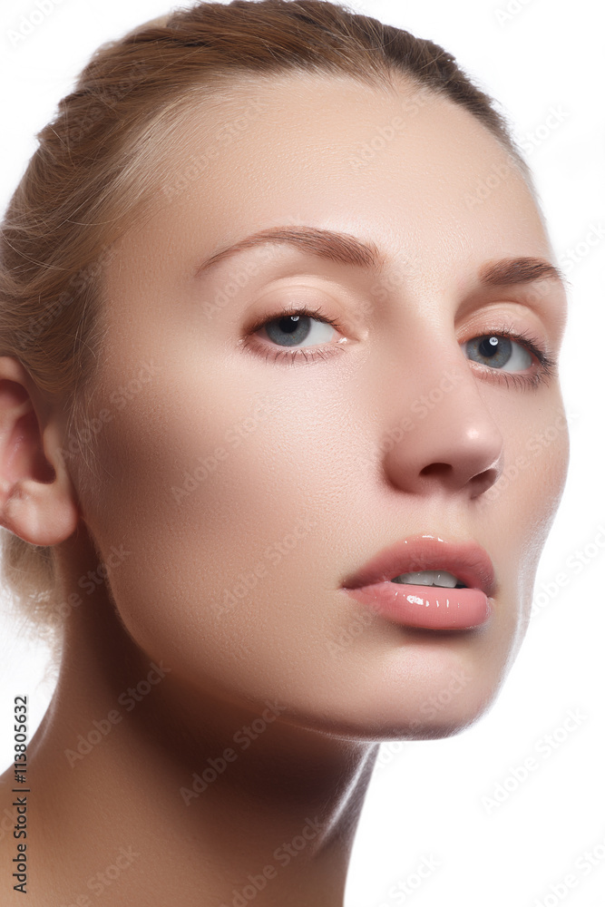 Beautiful face of young adult woman with clean fresh skin - isolated on white background