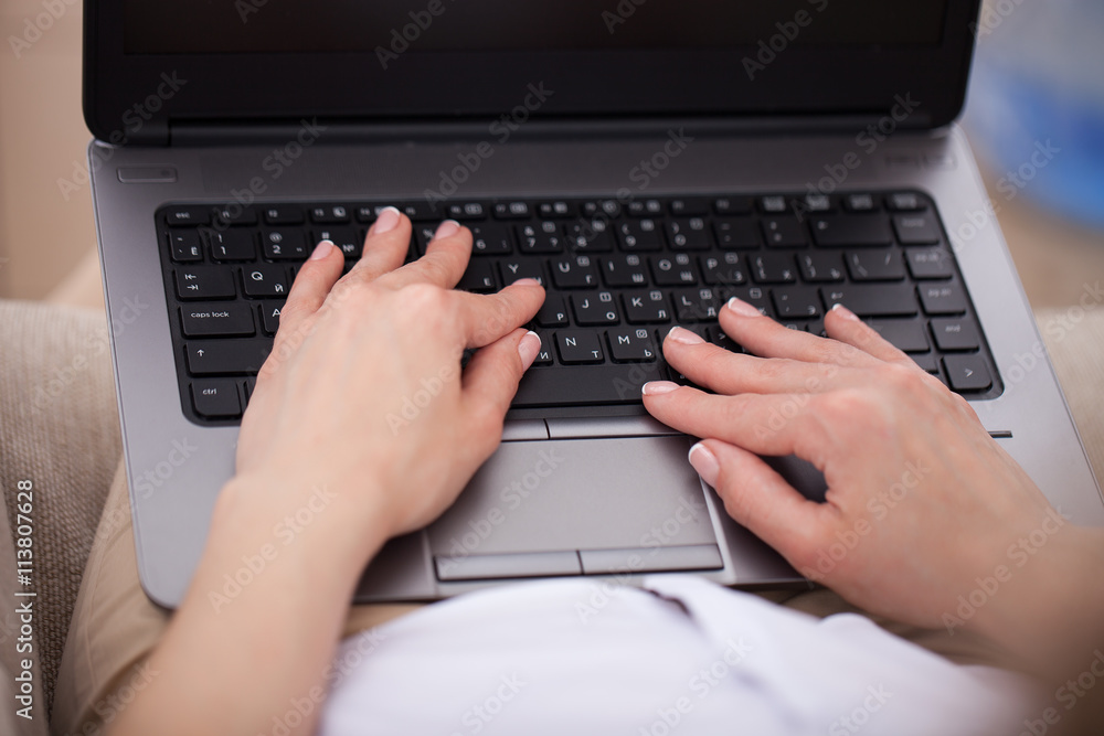 Woman typing on keyboard Woman typing on keyboard