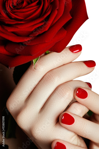 Fotografie, Obraz Beautiful manicured woman's hands with red nail polish