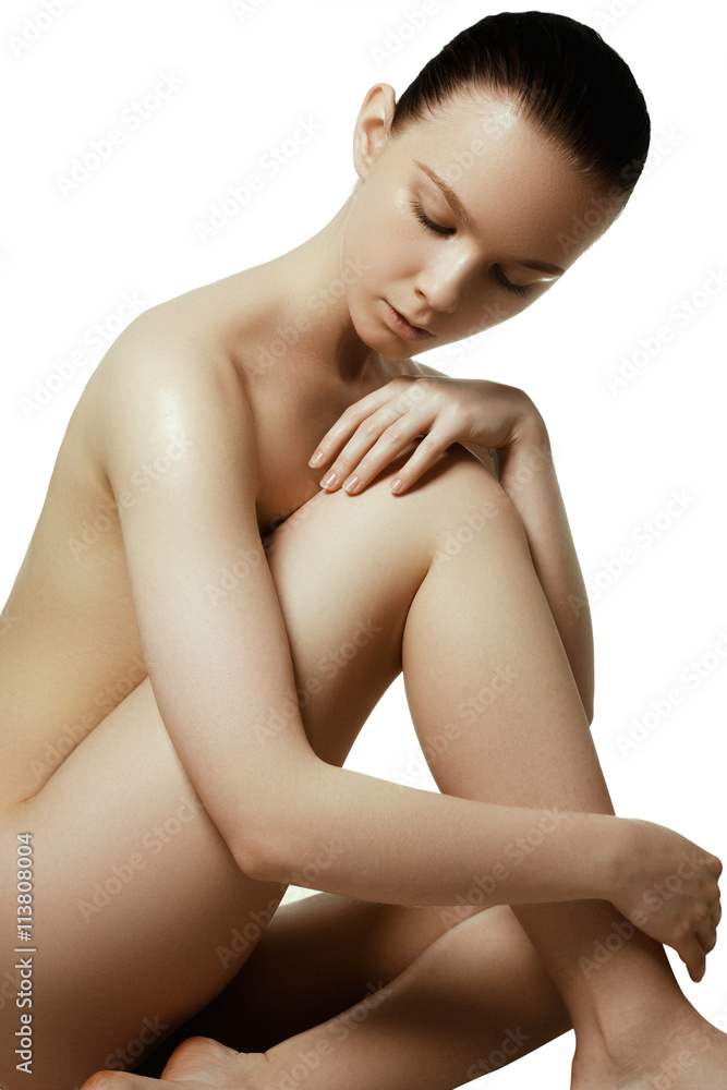 Fototapeta premium Picture of a healthy naked woman with perfect body over white.