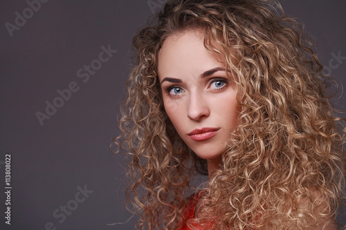 Portrait of woman with curly hair