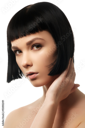 Beauty model with perfect glossy black hair. Close-up portrait.