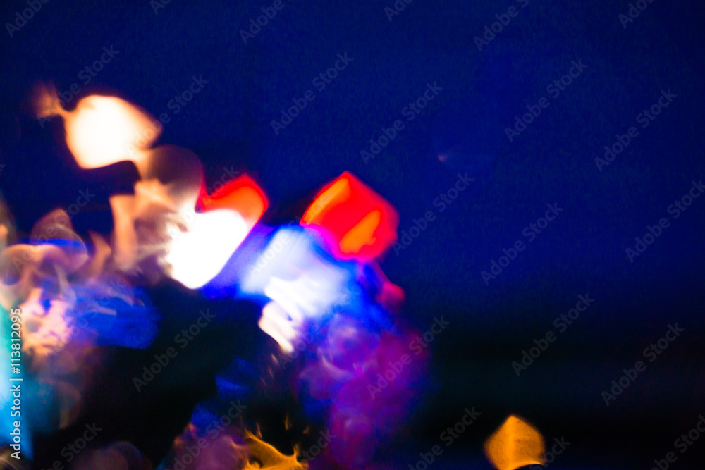 Fototapeta premium Abstract color background with bokeh lights inside from car