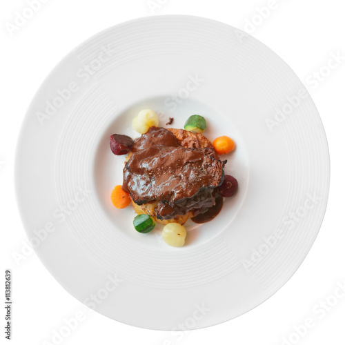 Meat with pepper sauce shot from above, isolated