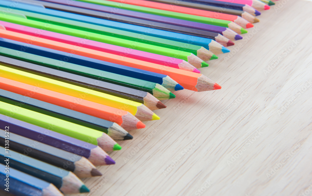 Obraz premium Colors pencils, colorful many crayons on wood background