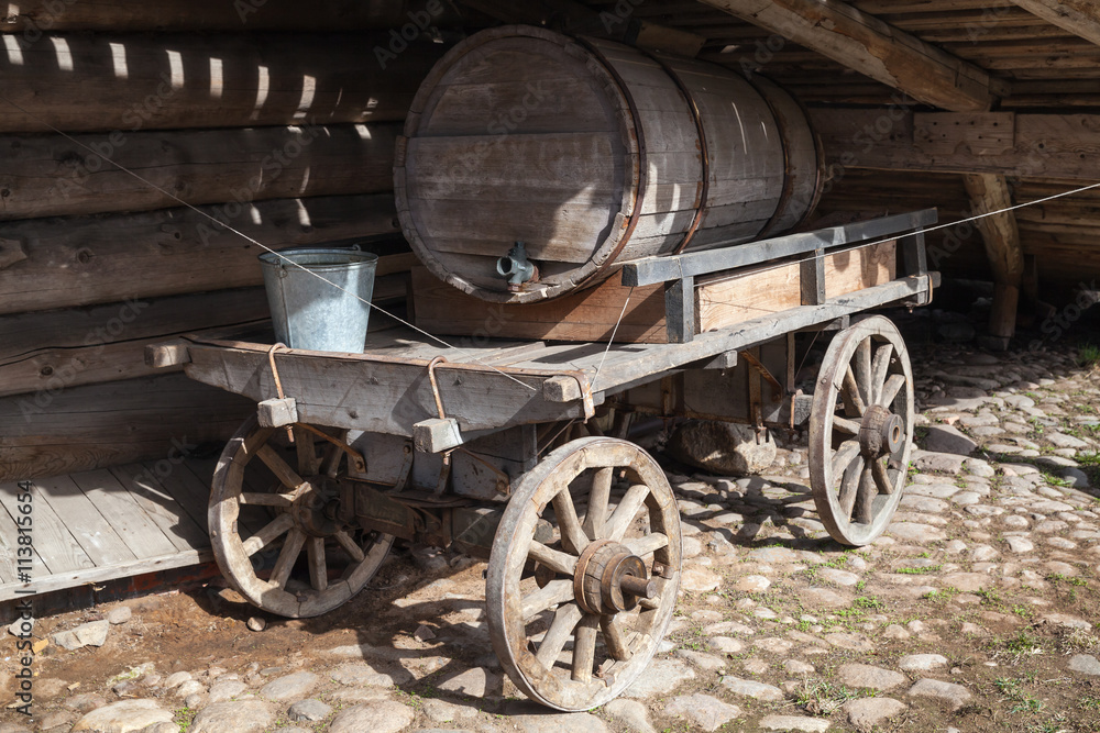 Old rural wooden cart, water tank