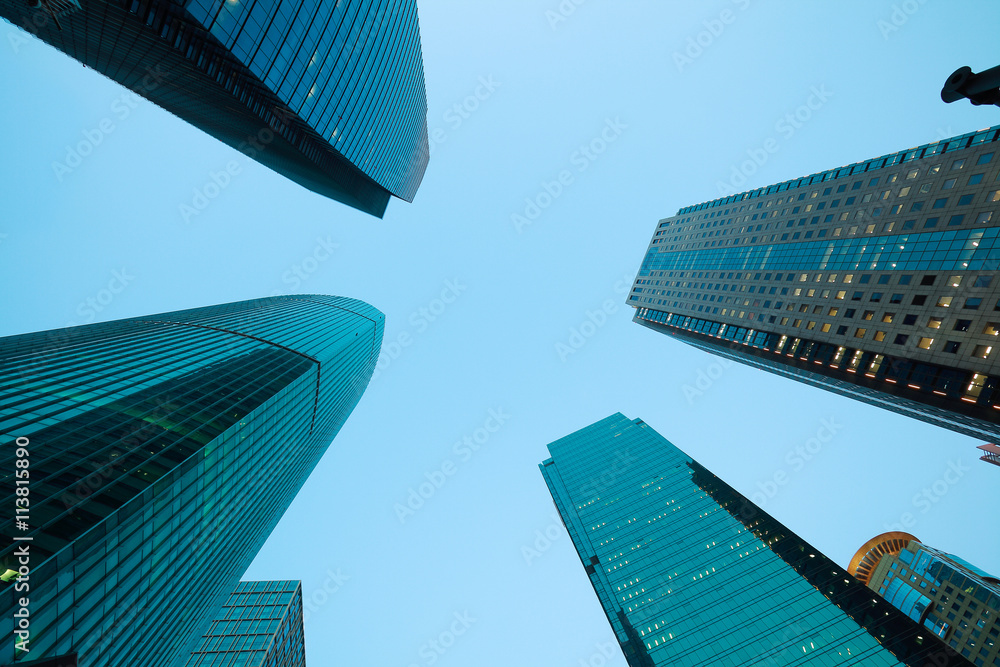 Looking up at Shanghai modern city buildings backgrounds