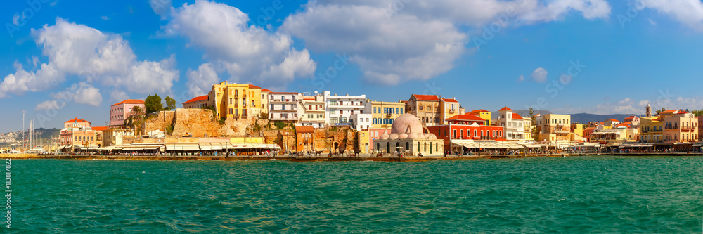 Panoramic view of old harbour of Chania with Venetian quay and Kucuk Hasan Pasha Mosque in the sunny morning, Crete, Greece