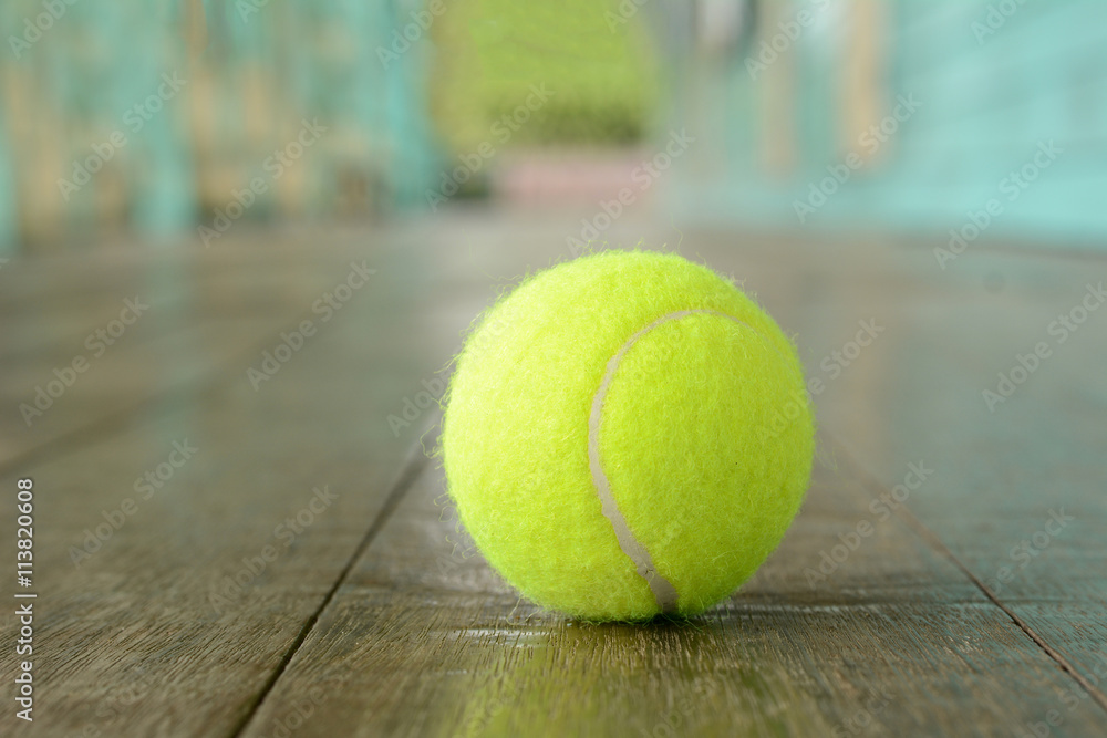 Tennis balls on the wooden floor