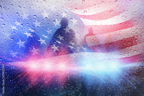 Police crime scene, rain background with police lights and american flag photo