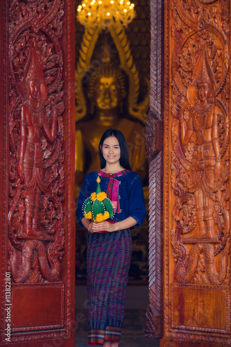 Asian woman wearing typical (Traditional) Thai dress in temple