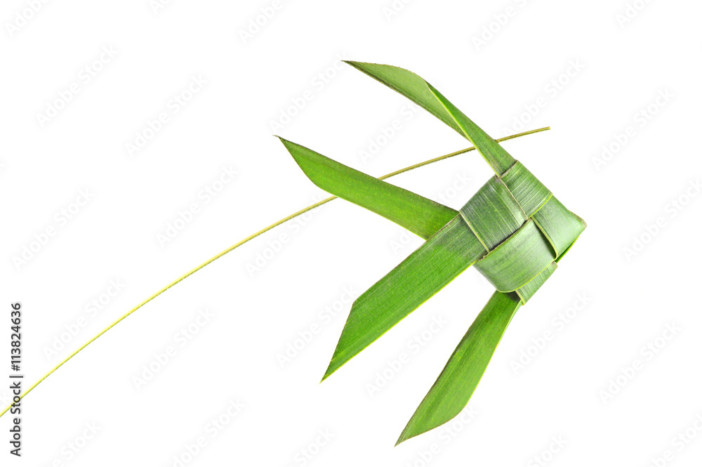 Thai woven coconut leaves fish on a white background Thai woven coconut leaves fish on a white background
