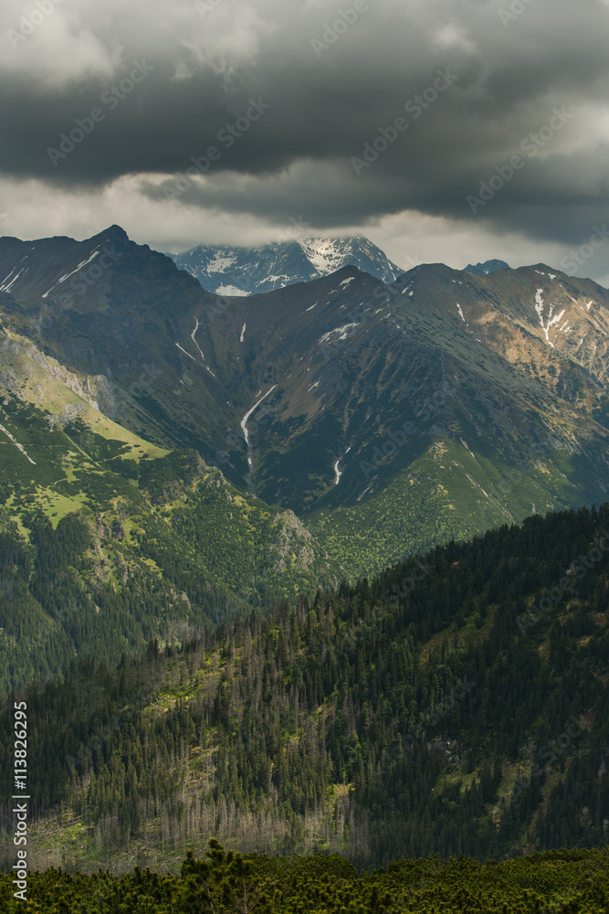 dramatic clouds over high Tatra mountains peaks