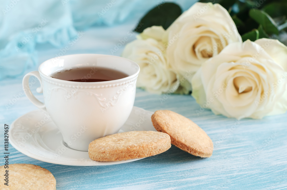 Tea in elegant porcelain cup and shortbread Tea in elegant porcelain cup and shortbread