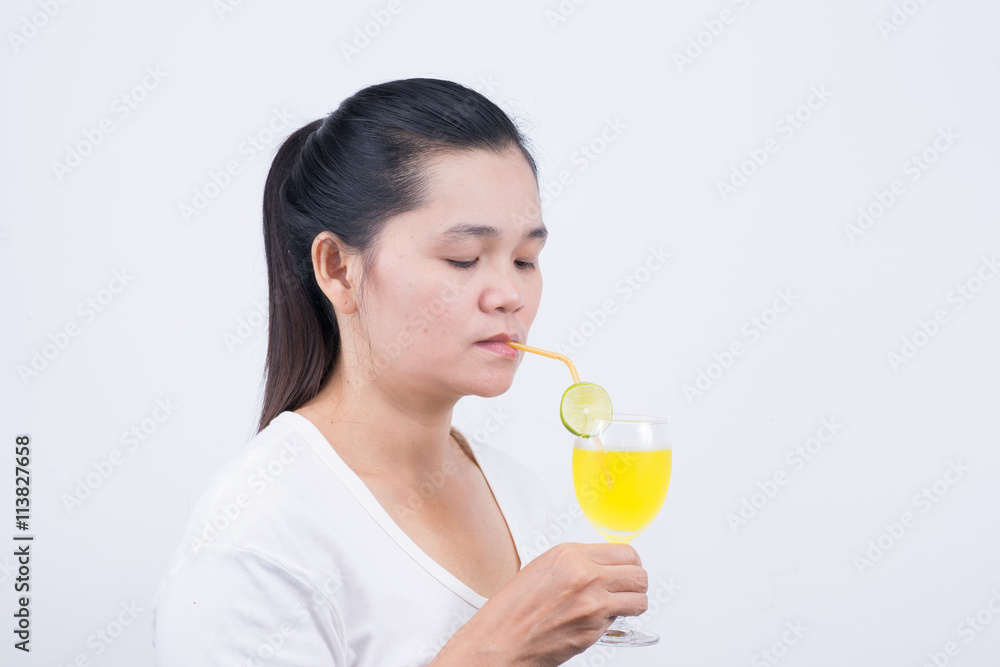 Woman drinking lemonad. Healthy food . Skin care and beauty. On Woman drinking lemonad. Healthy food . Skin care and beauty. On