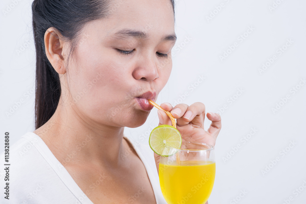 Woman drinking lemonad. Healthy food . Skin care and beauty. On Woman drinking lemonad. Healthy food . Skin care and beauty. On