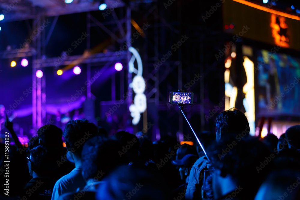Take photo in front of concert stage