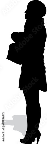 Vector silhouette of the standing girl in a skirt with a handbag