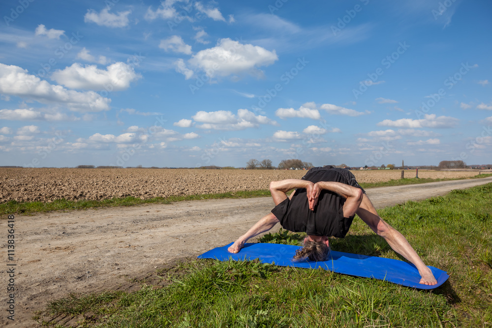 Enjoy prasarita padottanasana yoga in Nature