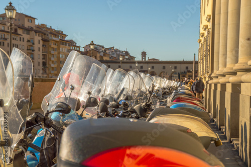 Scooters or motorbikes parked in a line  © t0m15