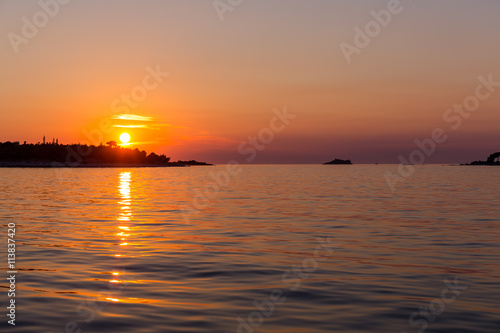 Sea sunset with ship trace © romantsubin