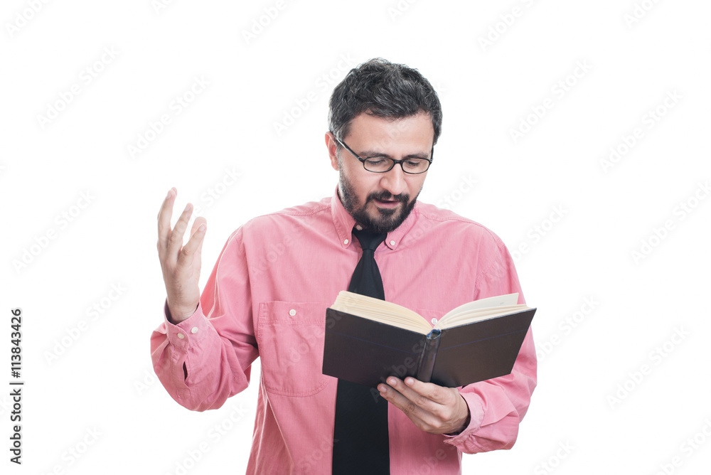 Young man reading a book and smiling Young man reading a book and smiling