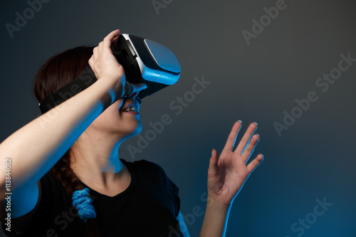 Woman using the virtual reality headset photo