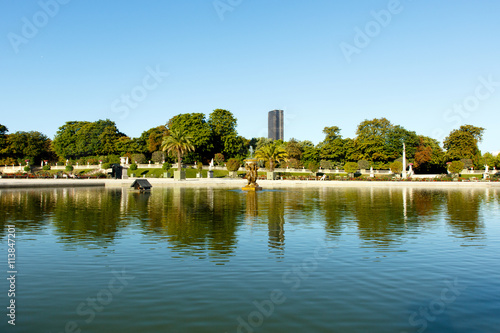 Wide angle view of pond in Luxembourg Gardens, Paris, France, with the Montparnesse Tower in the background. Horizontal with copy space for text