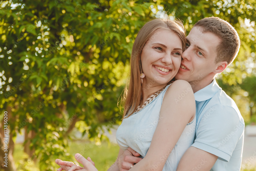 Portrait of Happy Couple Hugging Laughing